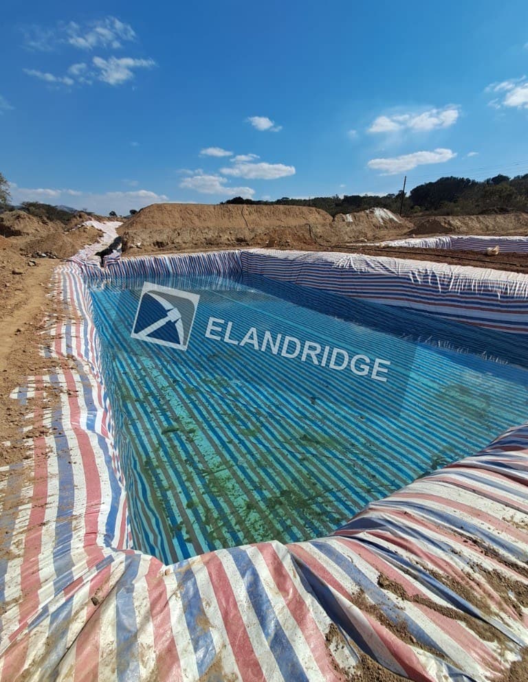 Lined process pond at the Penhalonga heap leach