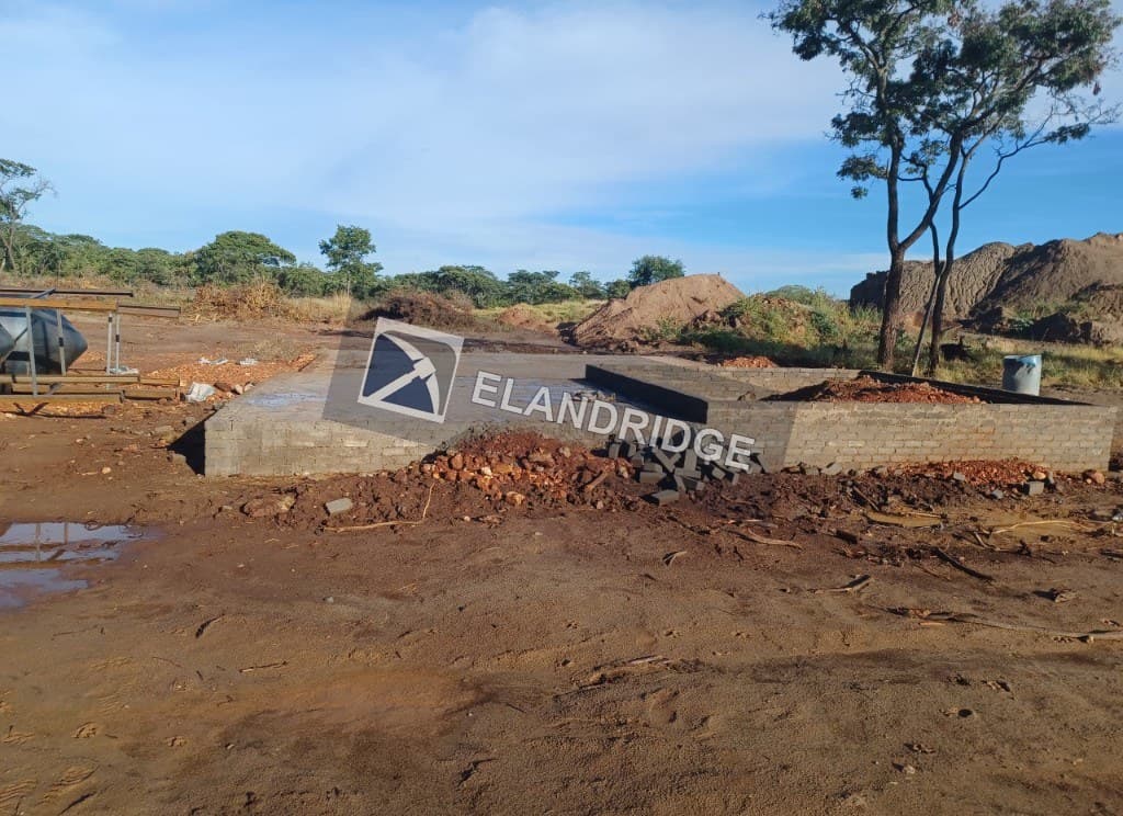 Concrete pad and brick enclosure for the CIP plant